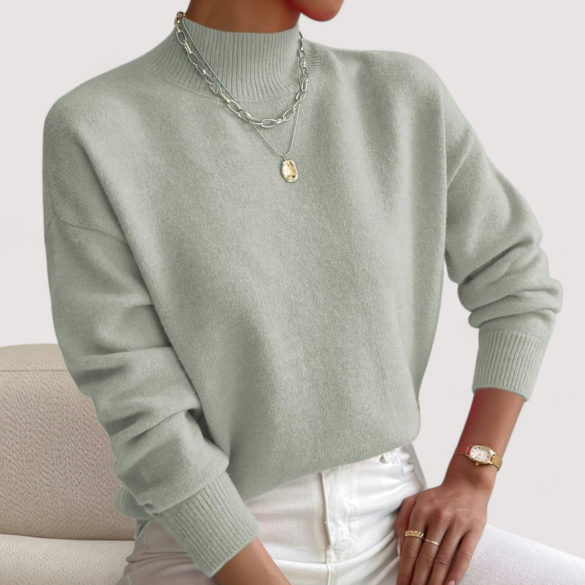 Elegant cream turtleneck sweater with flattering slim fit and soft ribbed neckline for all-day comfort