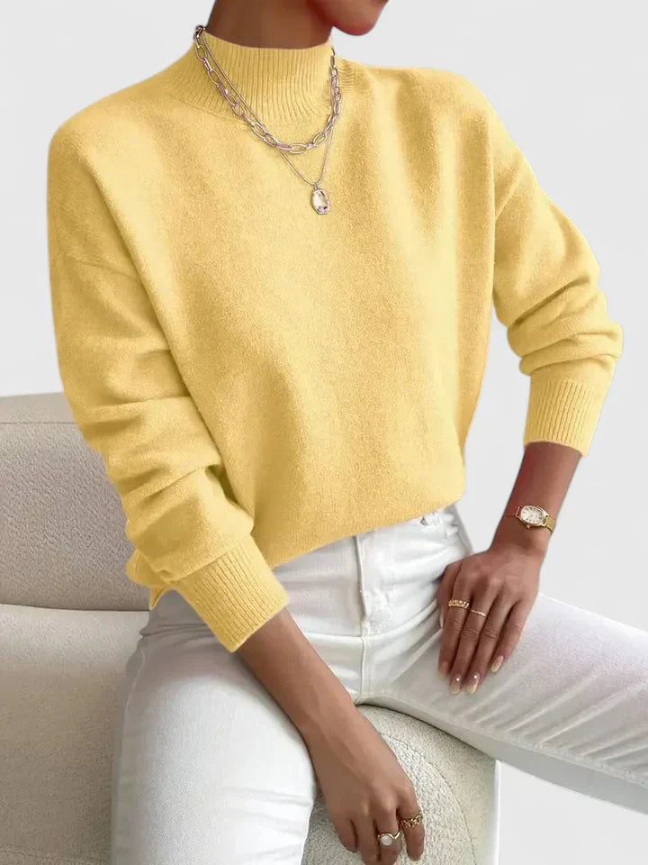 Elegant cream turtleneck sweater with classic high-neck design and soft breathable knit fabric