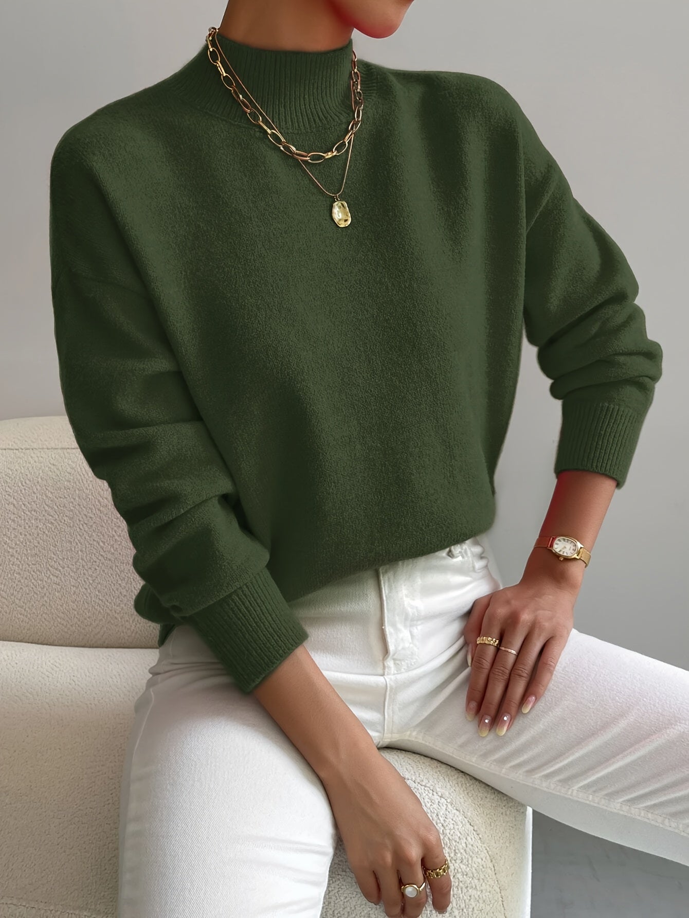 Elegant cream turtleneck sweater with flattering slim fit and classic elongating neckline design