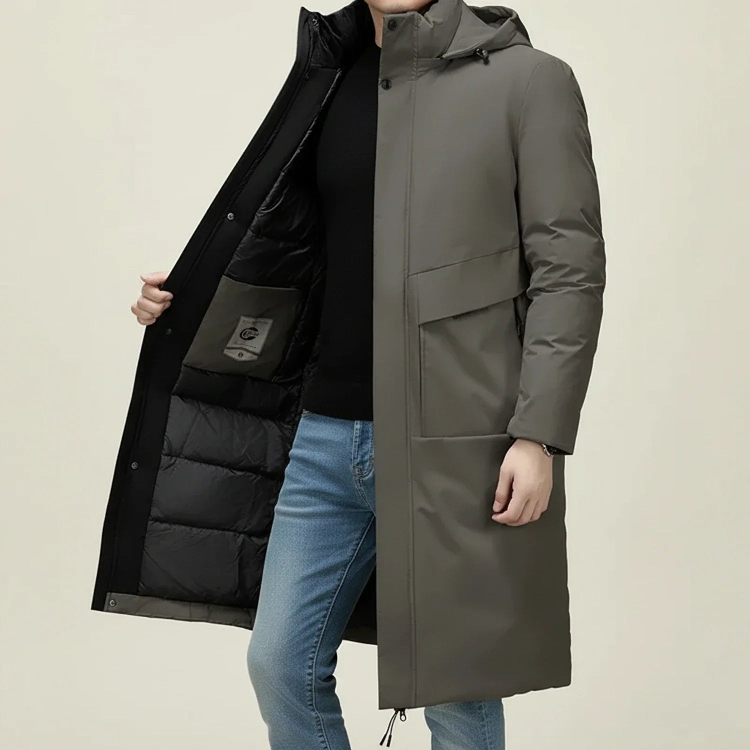 Men's long hooded insulated parka with drawstring hem, snap closure, and welt pockets