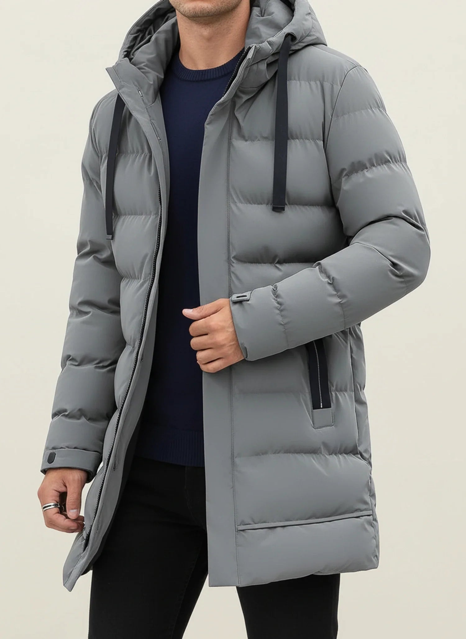 Men's black longline hooded puffer jacket with zip front, insulated quilted design for winter warmth