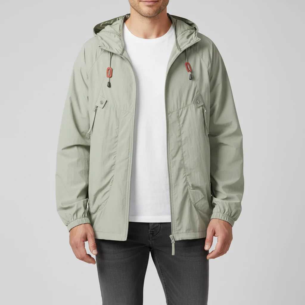 Men's lightweight navy windbreaker jacket with zip-up closure, drawstring hood, and raglan sleeves