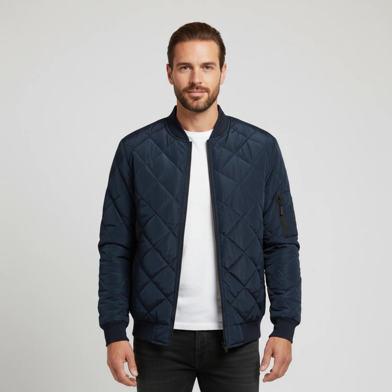 Black slim-fit quilted bomber jacket with diamond quilting pattern and lightweight zip-up design