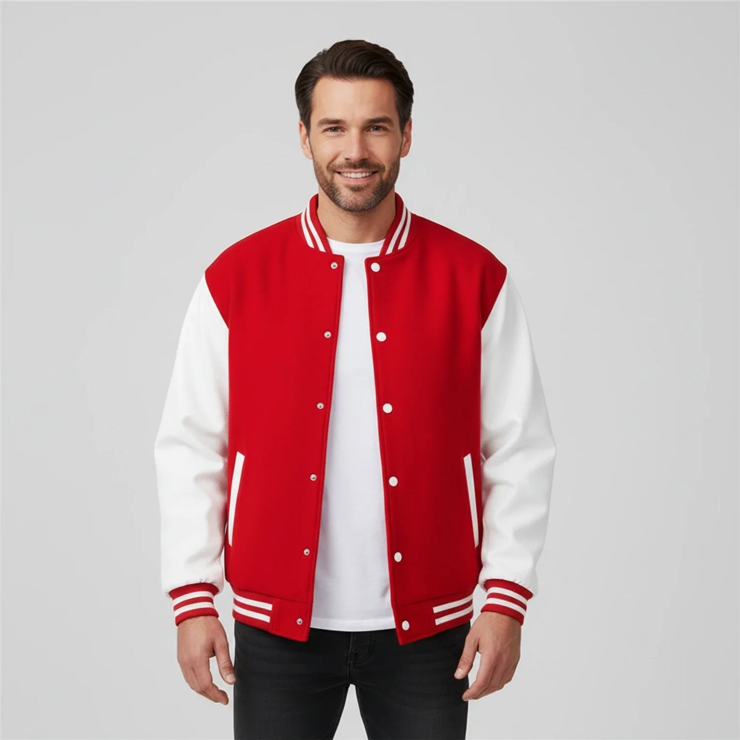 Men's black and white varsity jacket color block design with contrast sleeves and ribbed trim