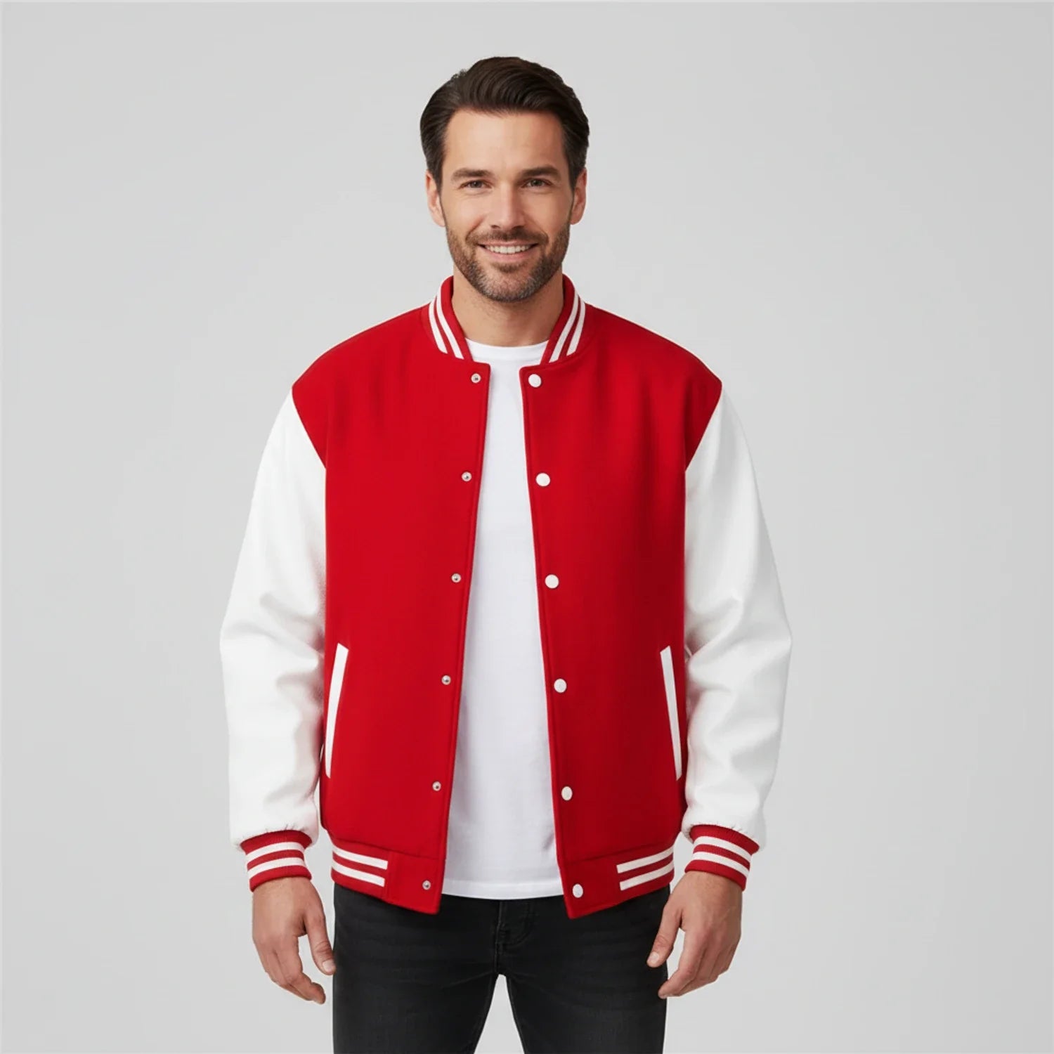 Men's black and white varsity jacket color block design with contrast sleeves and ribbed trim