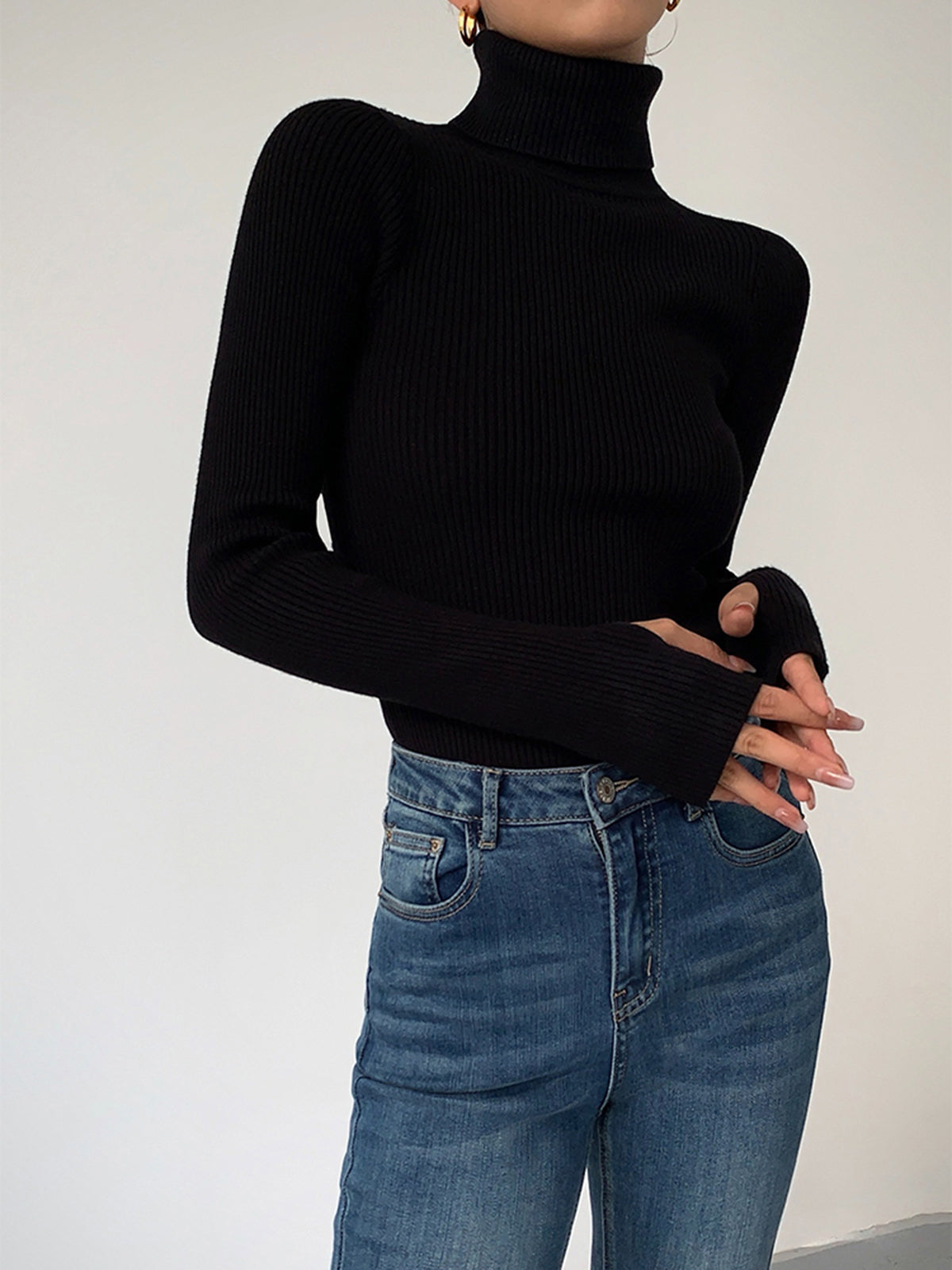 Minimalist slim fit turtleneck knit top in neutral tone, elegant casual style with medium stretch