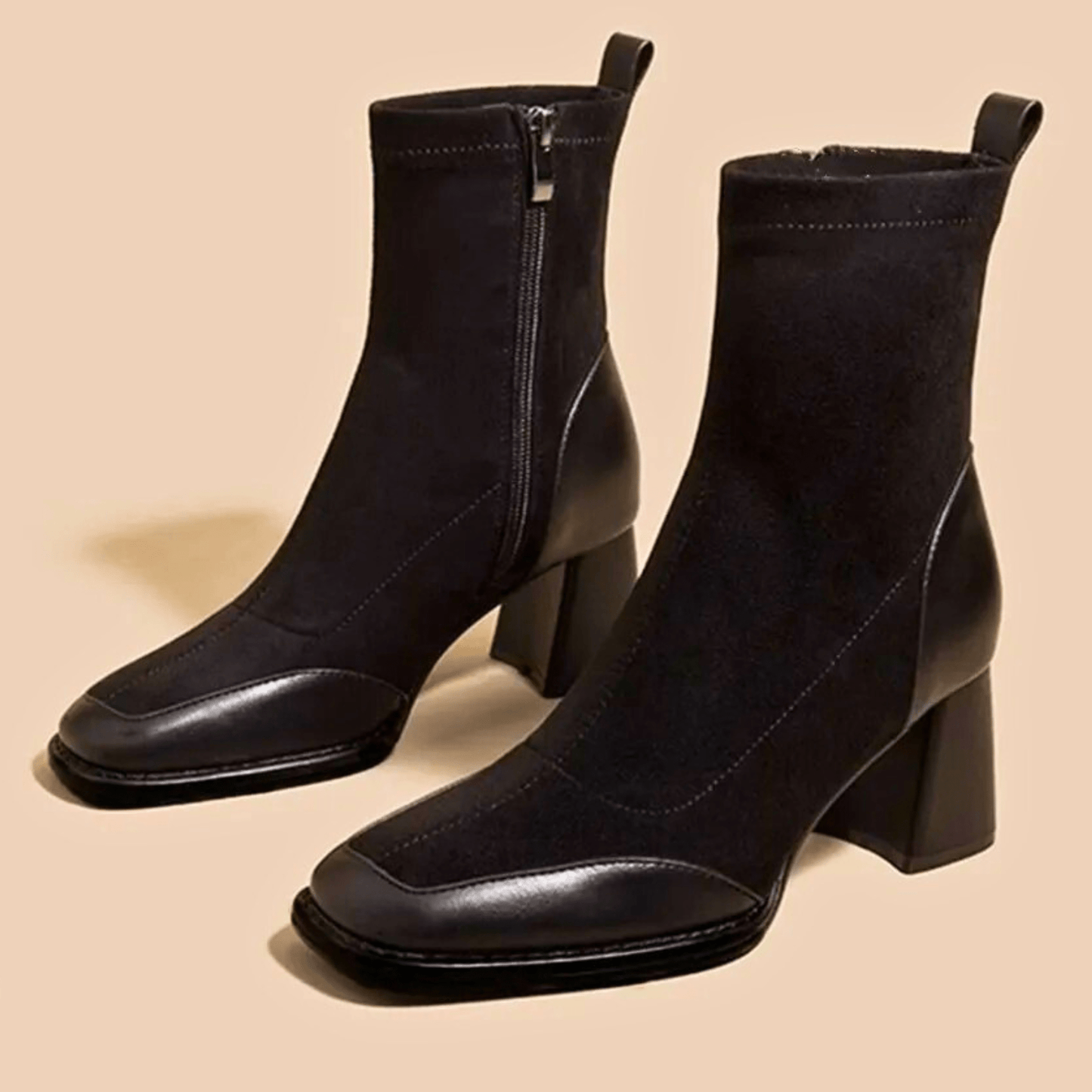 Black Maison ankle boots sleek streamlined silhouette with leg-lengthening polished design