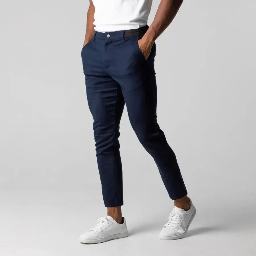 Men's slim fit ankle-length flat front stretch trousers in neutral tone, tailored modern silhouette
