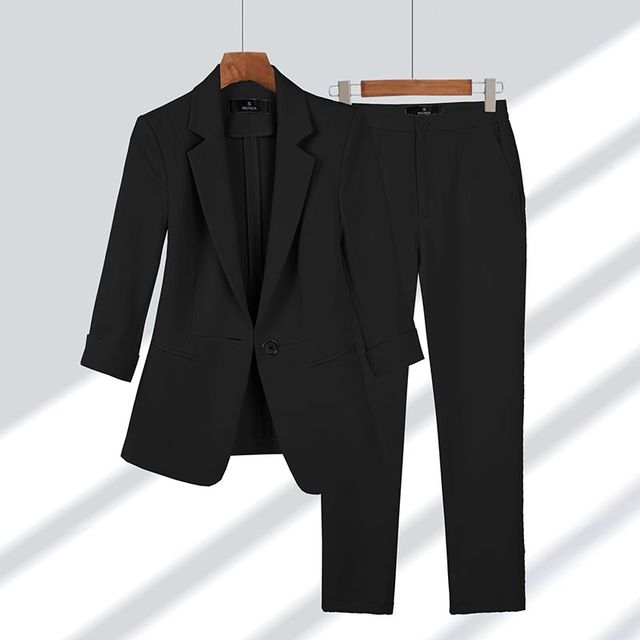 Women's slim-fit tailored blazer and trousers suit set, single-button closure, polished formal look