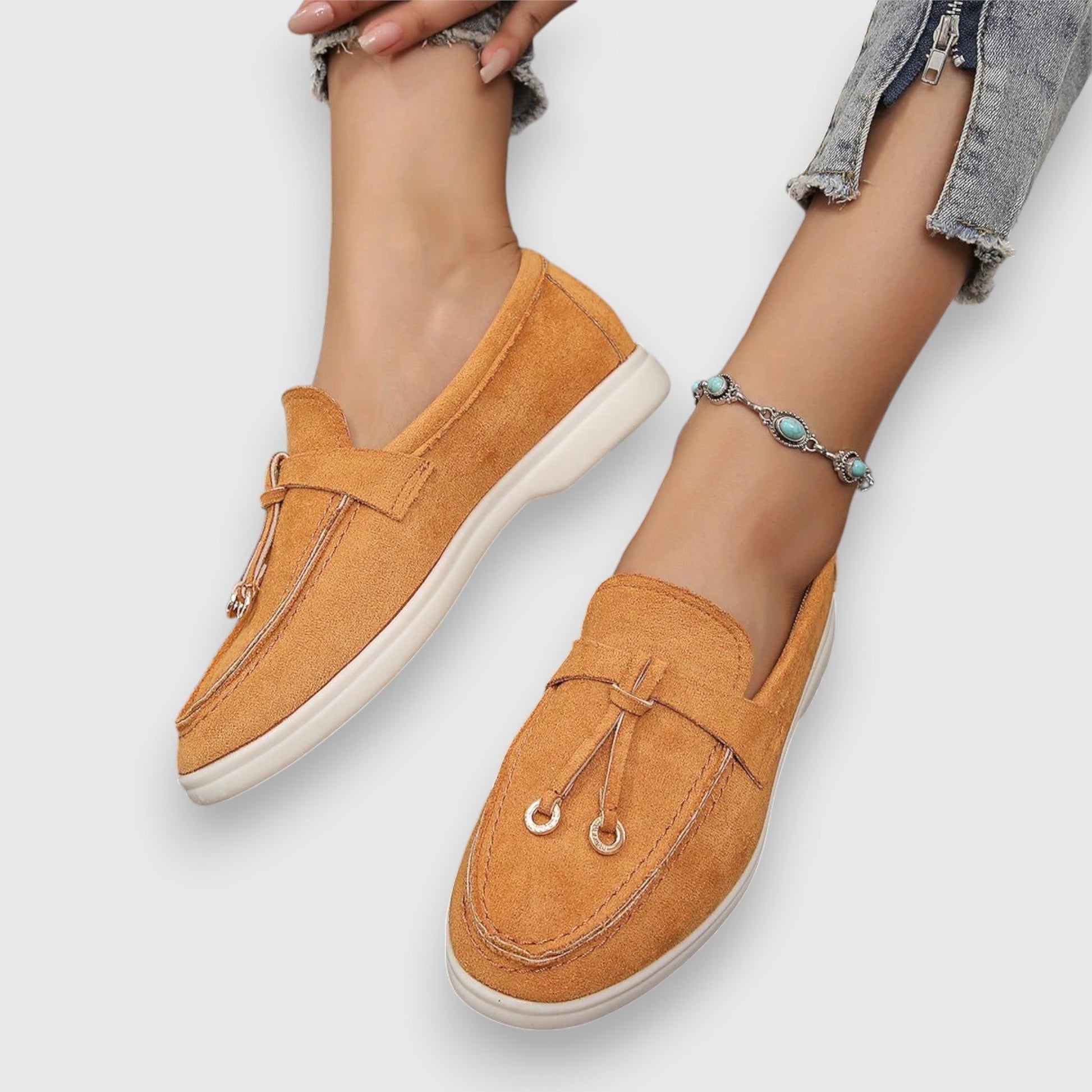Women's slip-on loafers in classic neutral tones with polished silhouette and cushioned arch support