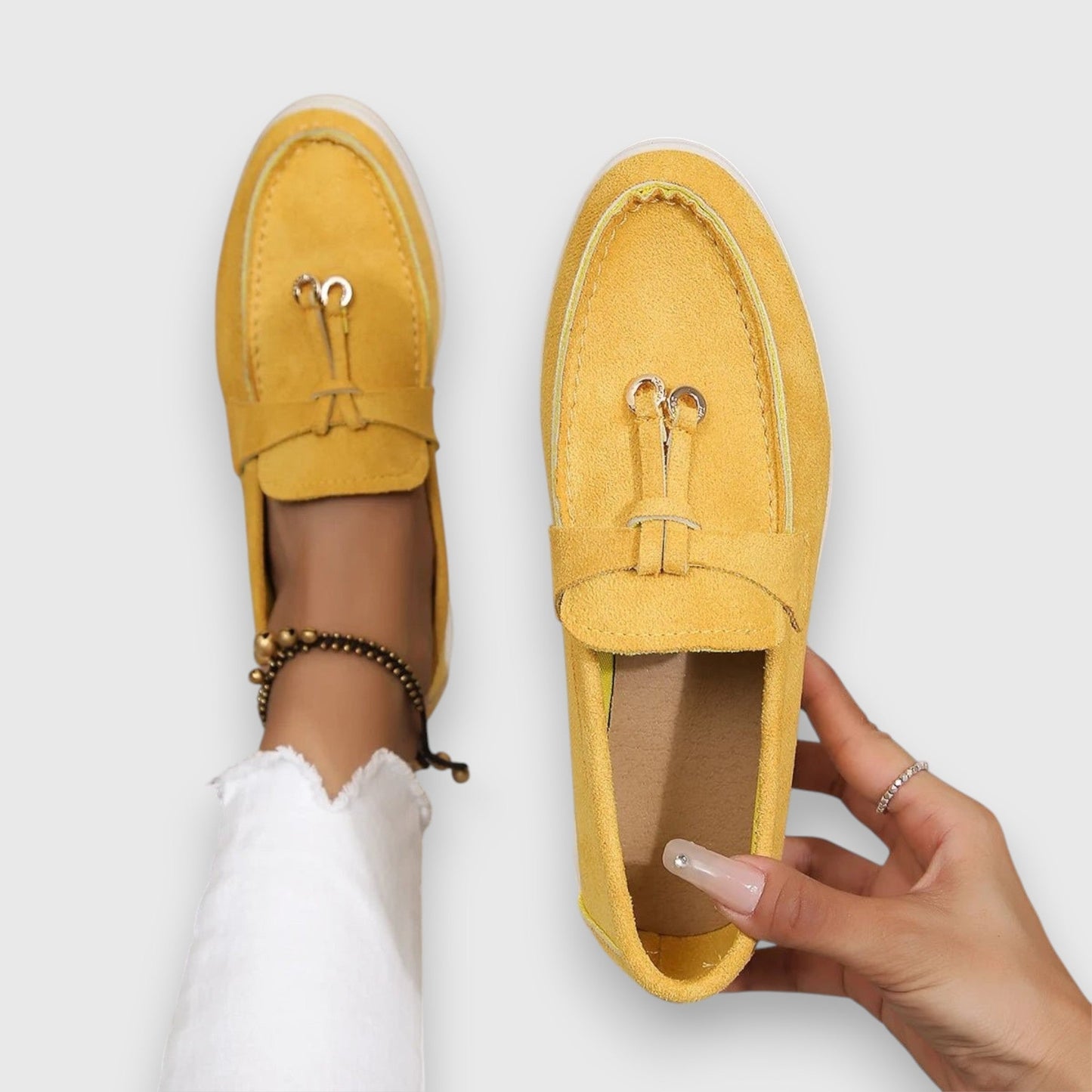 Women's slip-on loafers in classic neutral tones with polished silhouette and cushioned arch support