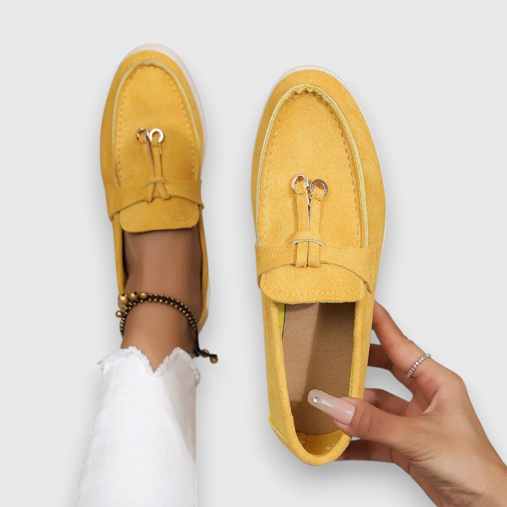 Women's slip-on loafers in classic neutral tones with polished silhouette and cushioned arch support