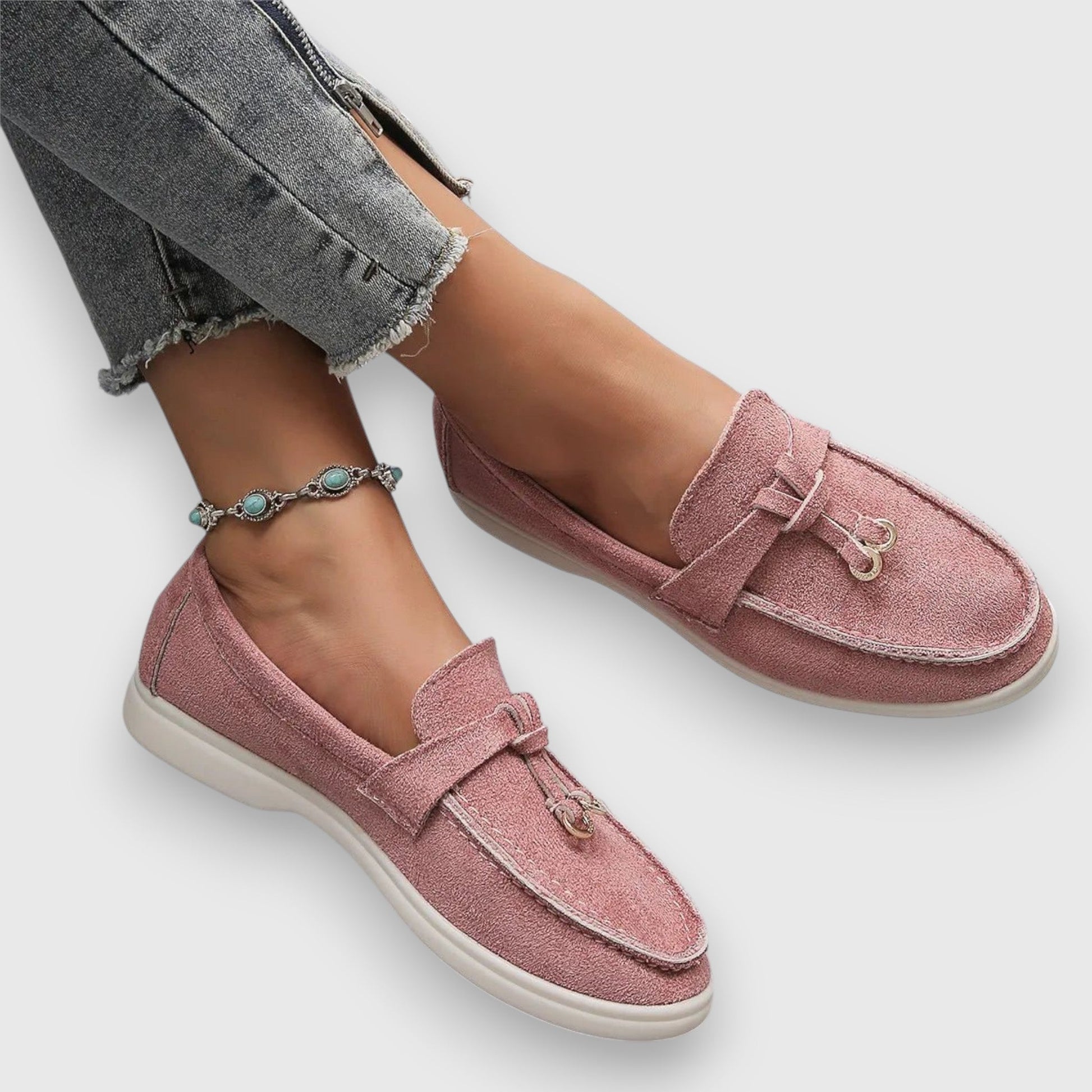 Women's slip-on loafers in classic neutral tones with polished silhouette and cushioned arch support