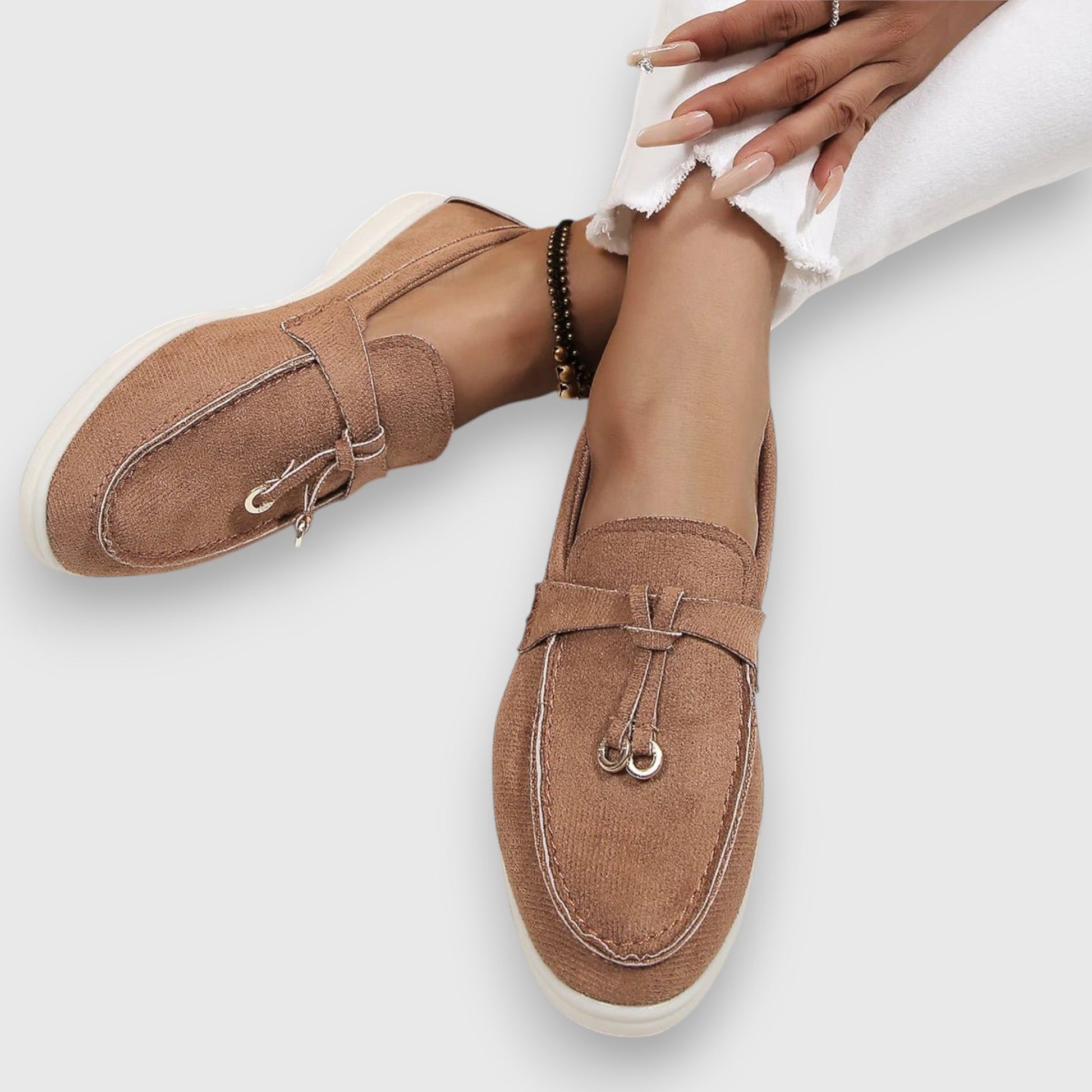 Women's slip-on loafers in classic neutral tone with polished silhouette and cushioned arch support