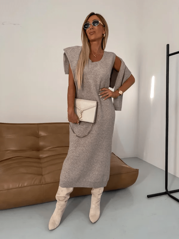 Women's beige knit midi dress with high turtleneck, long sleeves, relaxed fit, and smooth wool-blend drape