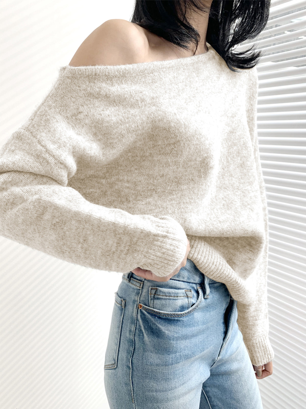 Ivory one-shoulder asymmetric knit sweater with cold shoulder cutout, casual elegant style
