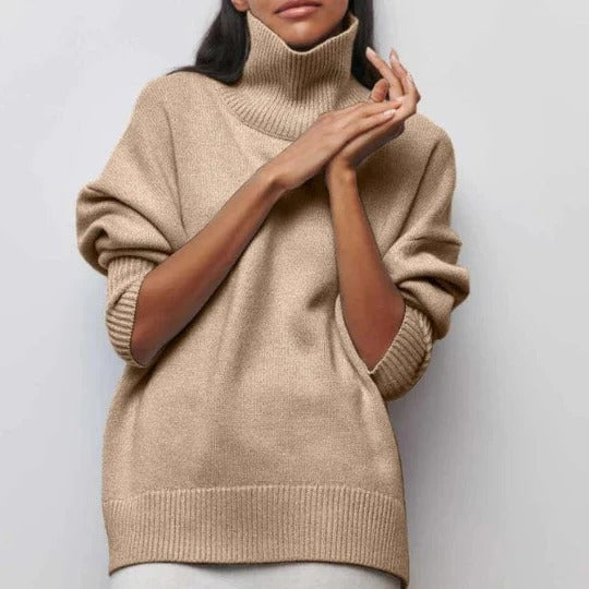 Cream oversized turtleneck sweater with relaxed fit, textured knit fabric, and high collar for casual layering