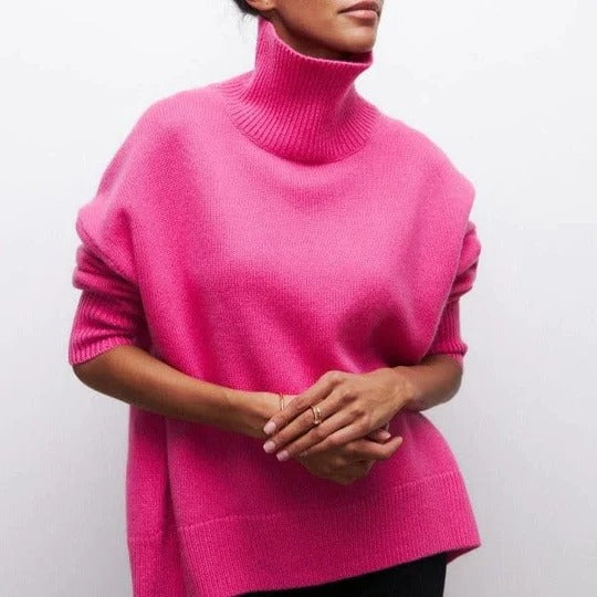 Cream oversized turtleneck sweater with relaxed silhouette and soft textured knit fabric