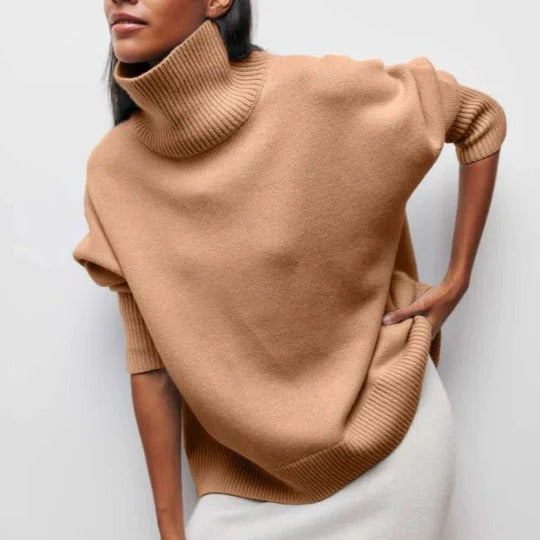 Cream oversized turtleneck sweater with relaxed fit, soft textured knit, and high collar for casual layering