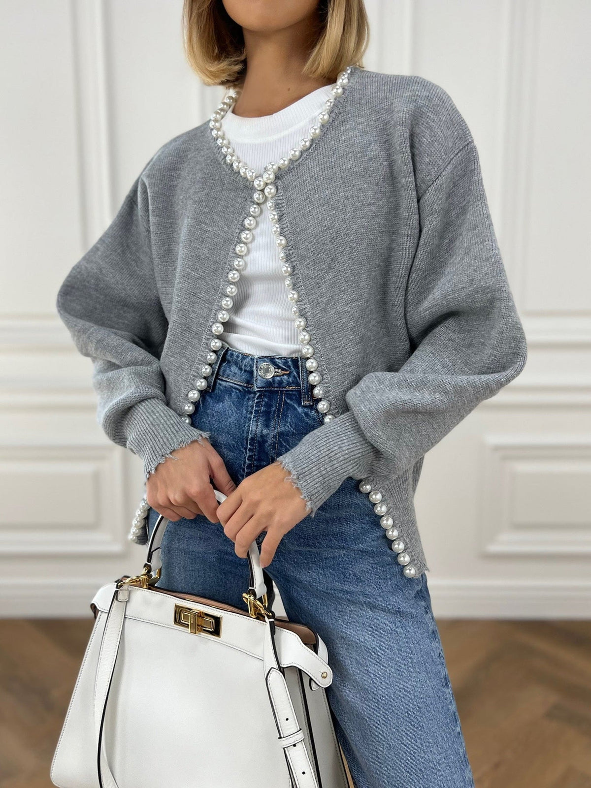 Ivory knit cardigan with pearl trim details, ripped hem, elegant regular fit style
