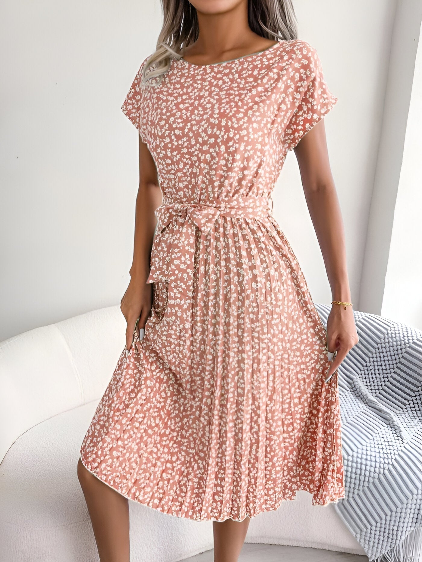 Floral print pleated A-line dress with vibrant blooms and flowing soft skirt for elegant feminine style