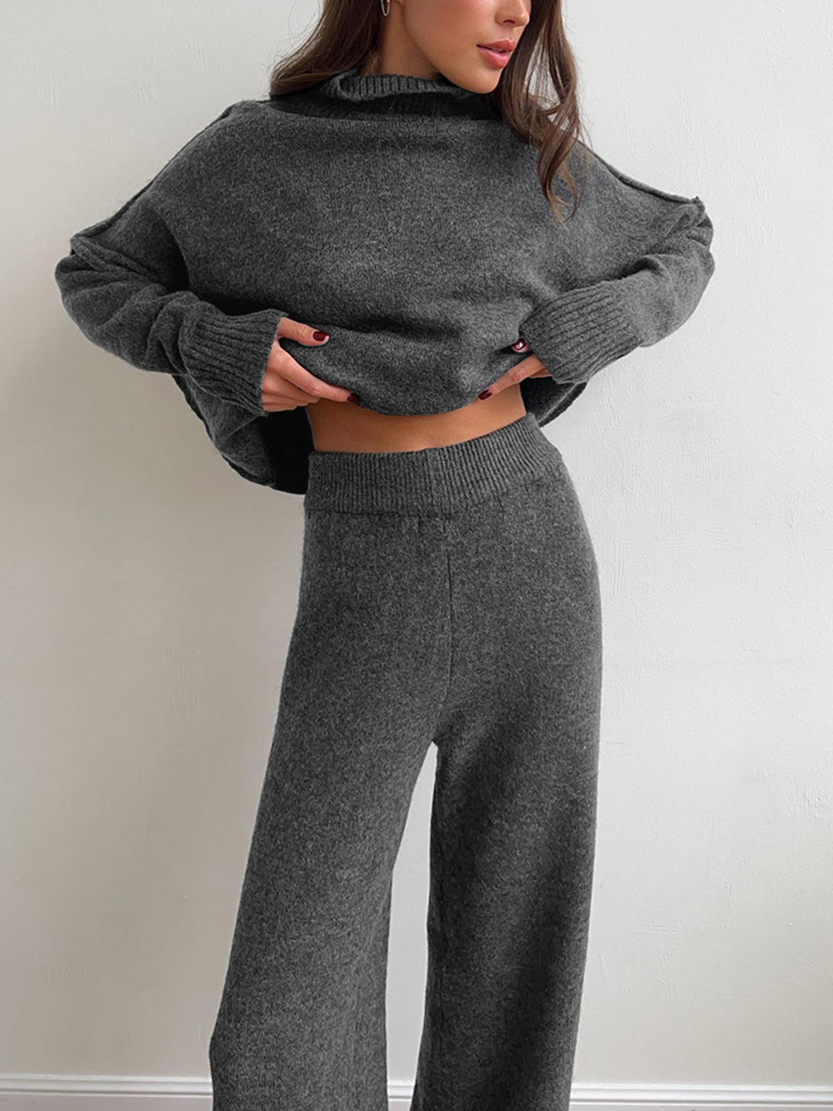 Casual knit turtleneck two-piece set with split-hem pants in neutral tone, medium stretch fit