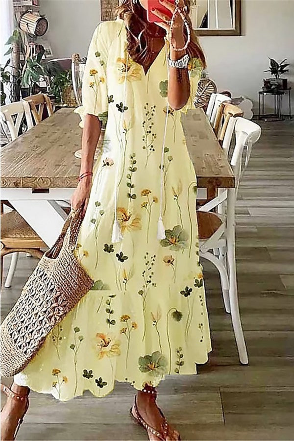 Women's boho floral print maxi dress with tassel V-neckline, flowing A-line silhouette in watercolor botanical print