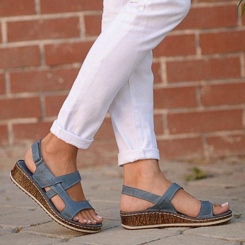 Strappy open-toe wedge sandals in neutral tones with multi-strap upper and lightweight summer sole