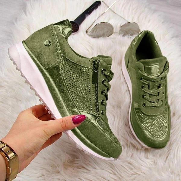 Women's low-top fashion sneaker in metallic finish with rhinestone zip-up lace-up detailing