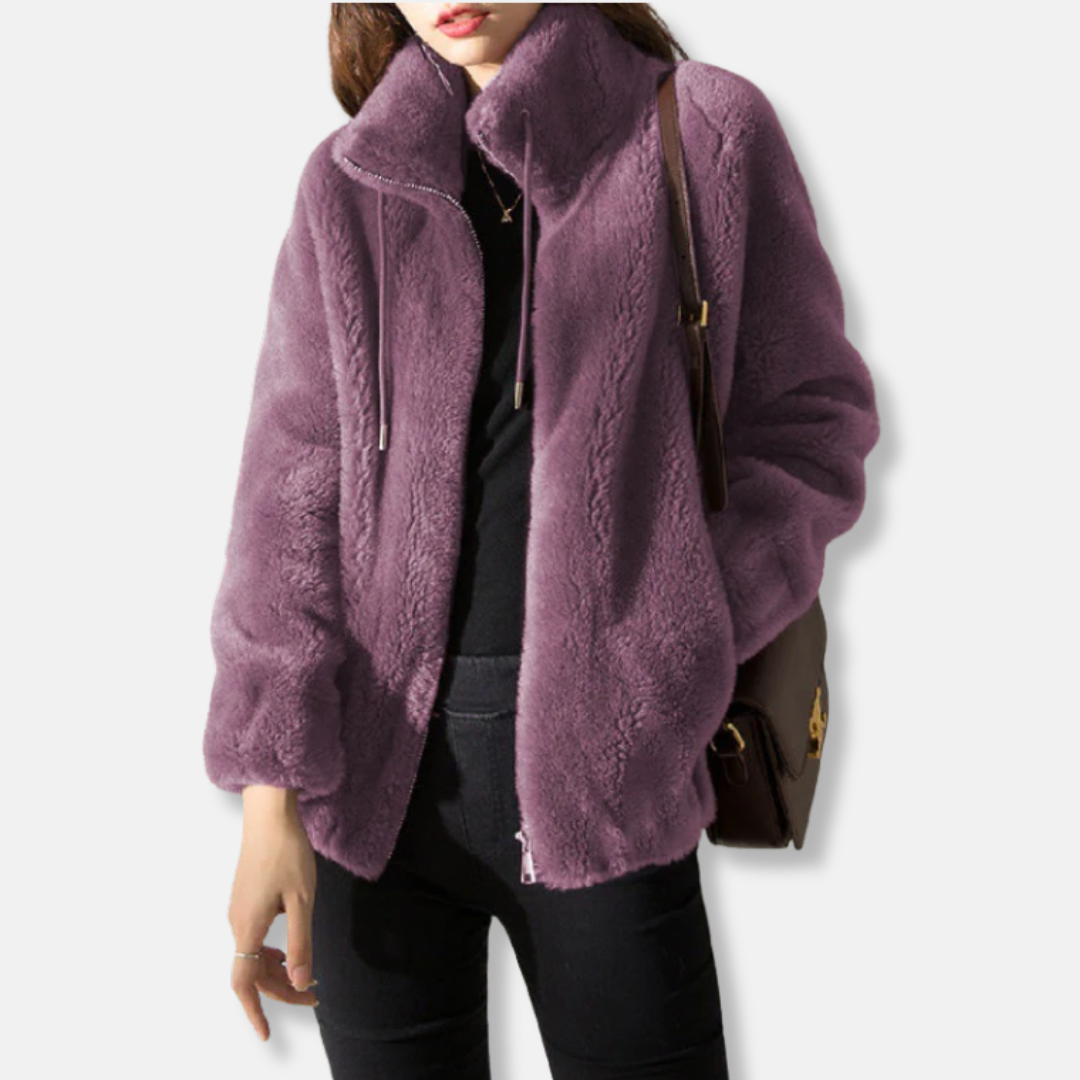 Women's relaxed fit fleece jacket with stand collar, full zip closure, and elastic cuffs for cozy layering