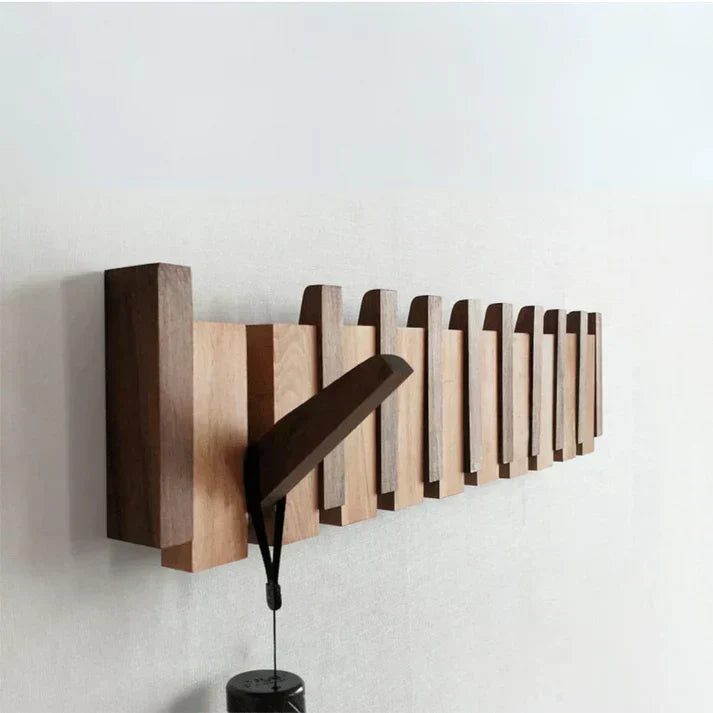 Minimalist wooden wall-mounted coat rack with natural grain finish and clean modern design