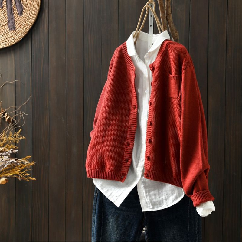 Women's beige relaxed knit cardigan with cozy fabric and front button detail for layering