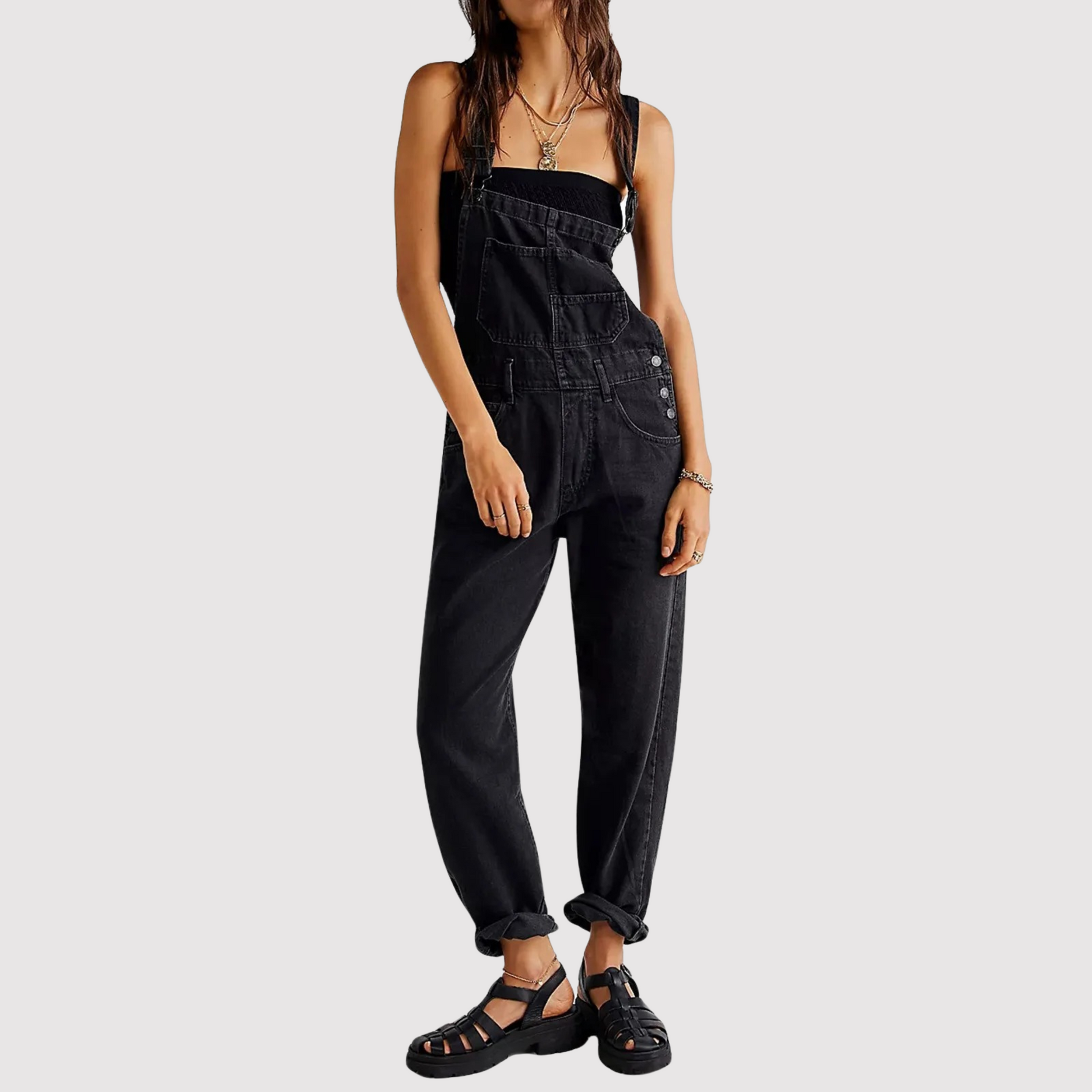 Women's relaxed fit blue denim jumpsuit with deep round neckline and oversized patch pockets