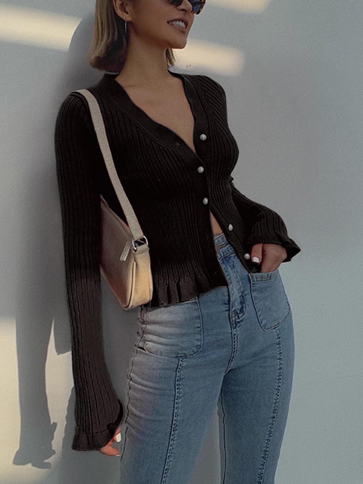 Elegant slim fit ribbed knit cardigan with ruffled lettuce trim, pearl buttons, long sleeves