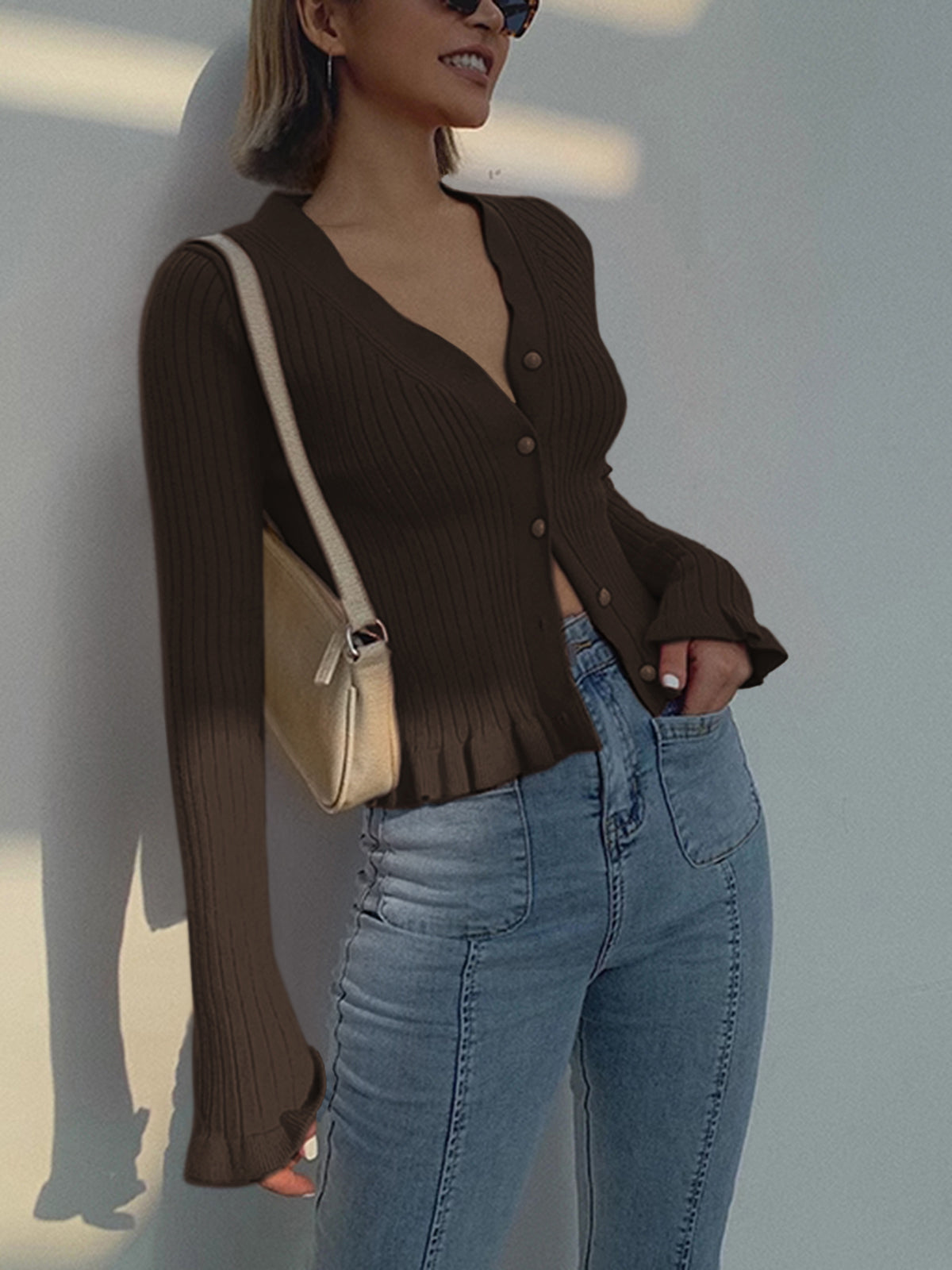 Elegant slim fit knit cardigan with ruffled lettuce trim, pearl buttons, long sleeves, high stretch