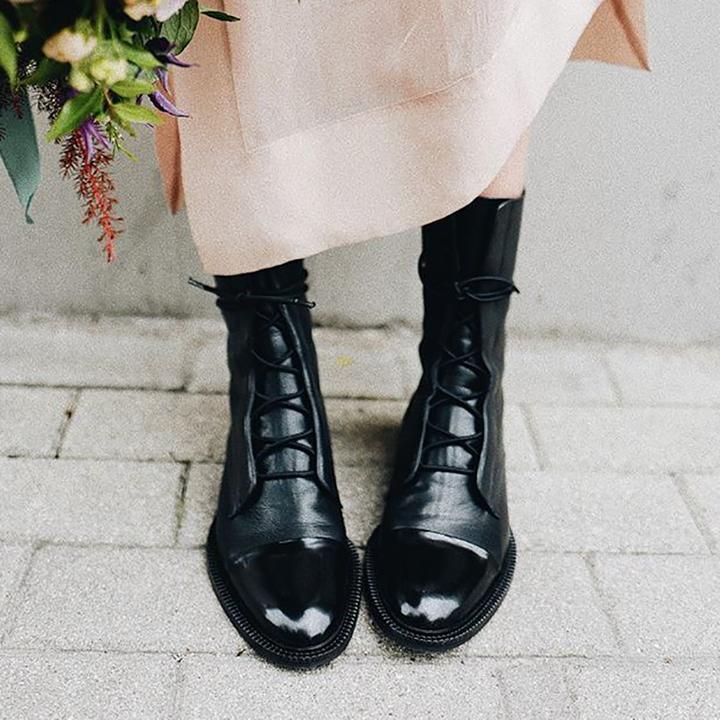 Black luxurious heeled boots with sleek slim heel, elegant silhouette for day-to-night styling