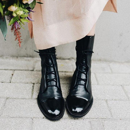 Black luxurious heeled boots with sleek slim heel, elegant silhouette for day-to-night styling