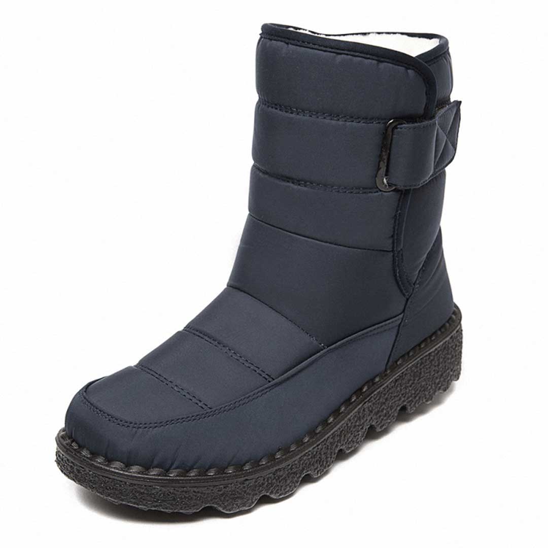 Women's mid-calf winter boots with velcro strap, plush insulation, and non-slip traction sole