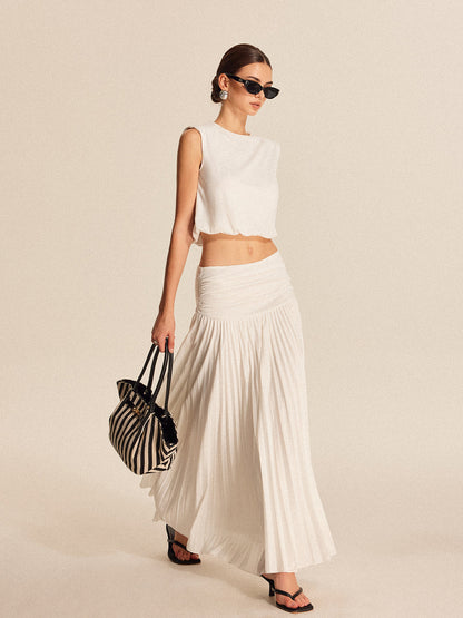 Shoulder-padded pleated skirt set in jersey fabric with invisible zipper, regular fit