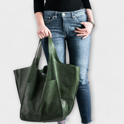 Beige minimalist tote bag with spacious interior and sleek structured silhouette for everyday use