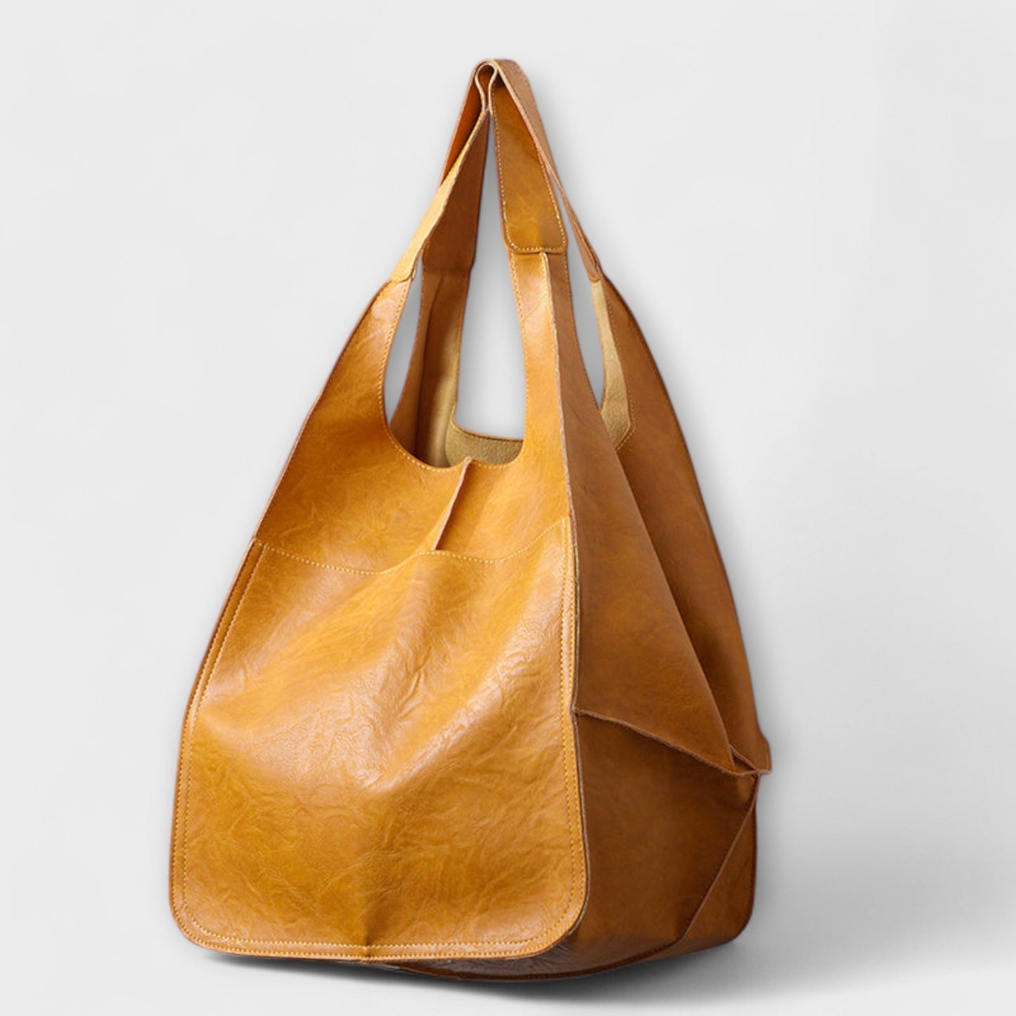 Minimalist spacious everyday tote bag in neutral tone with sleek structured silhouette and clean design
