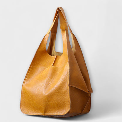 Minimalist spacious everyday tote bag in neutral tone with sleek structured silhouette and clean design