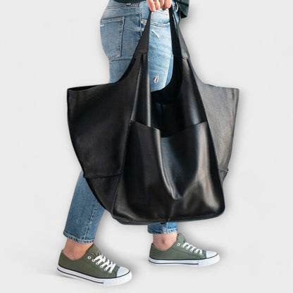 Beige minimalist everyday tote bag with spacious interior and sleek structured silhouette