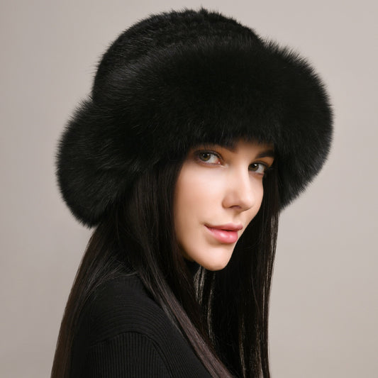 Solid fur hat with round crown silhouette and stylish fur brim for winter elegance