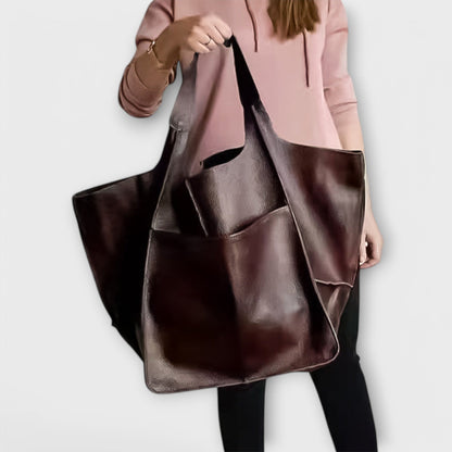 Minimalist spacious everyday tote bag in neutral tone with sleek silhouette and clean structured design