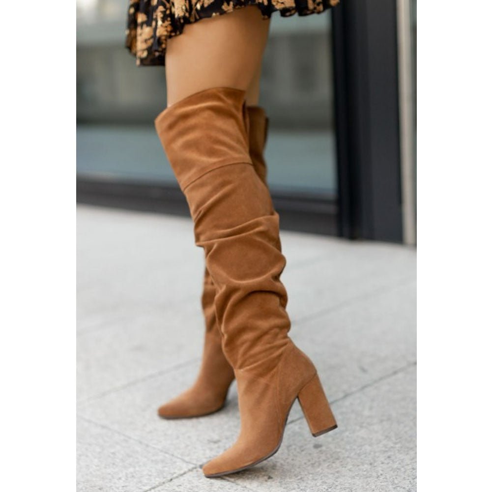 Women's over-the-knee slouchy high heel boots in neutral tone with pointy toe elegant silhouette