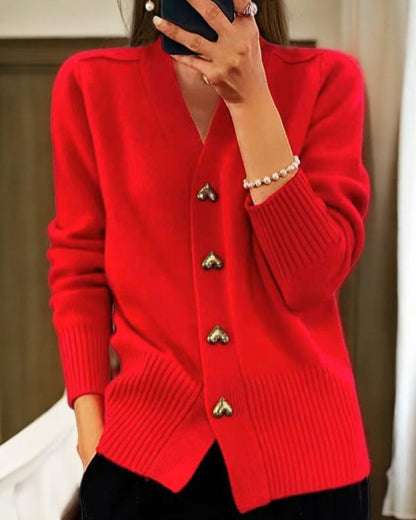 Soft elegant cardigan with heart-shaped buttons, flattering silhouette, perfect for layering