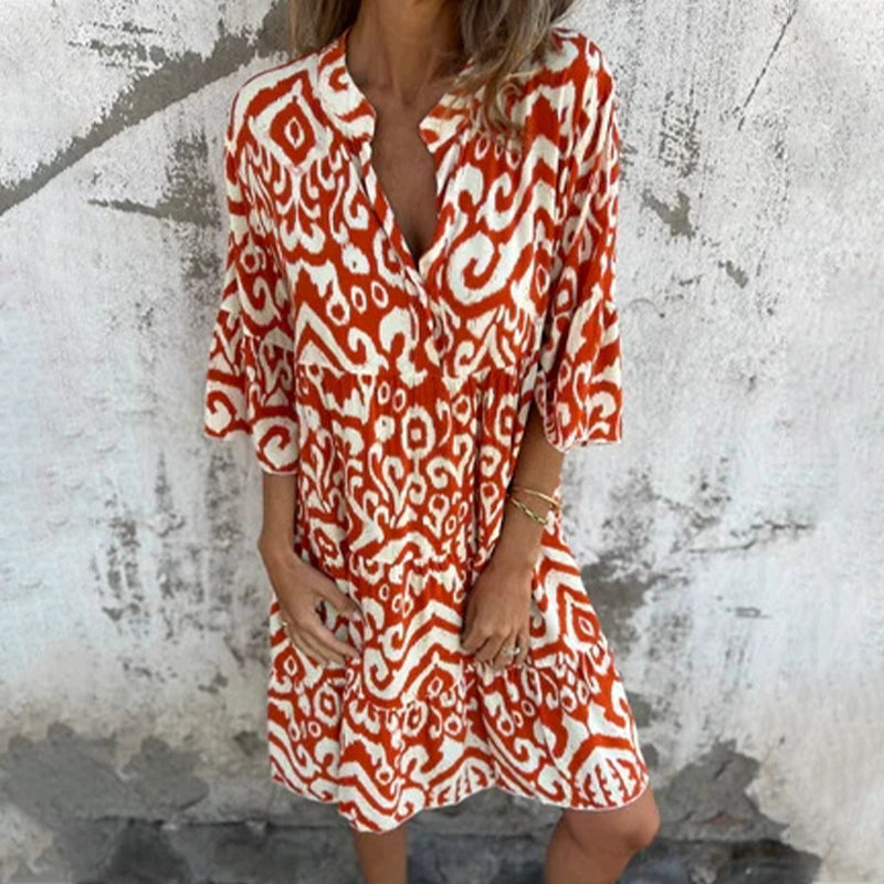 Women's printed draped elegant dress with chic patterned sleeves and flattering silhouette