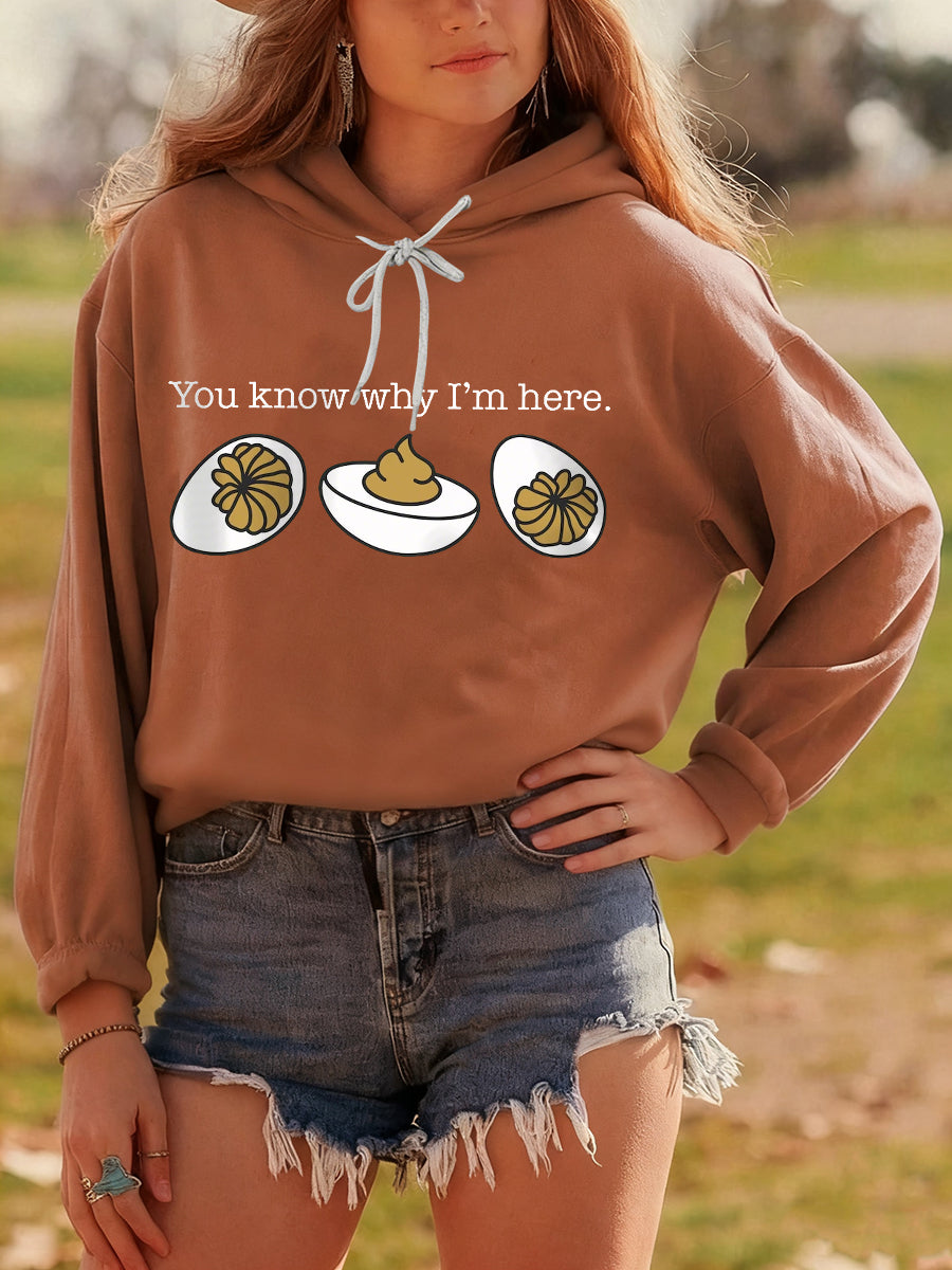 Cozy relaxed-fit hoodie with playful Thanksgiving turkey humor print, perfect for festive fall gatherings