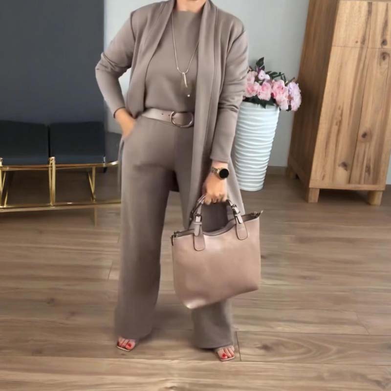 Elegant black 3-piece tailored set with sleek silhouette and luxurious fabric for versatile wear